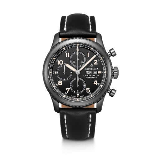 A Breitling chronograph wristwatch with a black dial, black bezel, and a black leather strap with white stitching.
