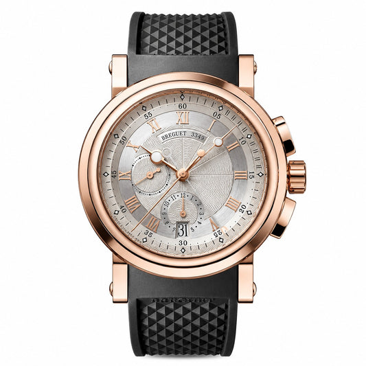 A luxury wristwatch by Breguet, featuring a round rose gold case, a silver dial with Roman numerals and chronograph subdials, and a textured black rubber strap.