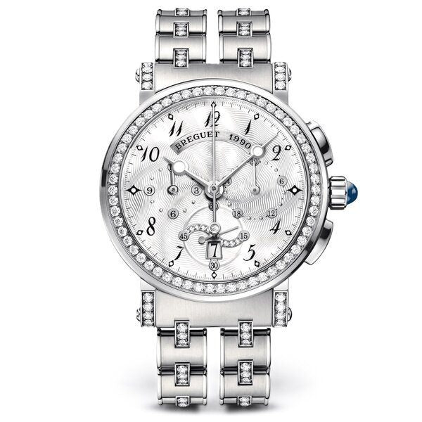 A luxury silver-tone wristwatch with a diamond-encrusted bezel, matching diamond-set bracelet, and a white dial featuring multiple subdials and a day window. The brand name 'BREGUET' is visible on the dial.