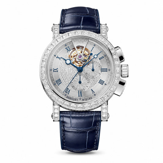 Breguet watch with a diamond-set case, silver dial, visible tourbillon, blue hands, and dark blue leather strap.