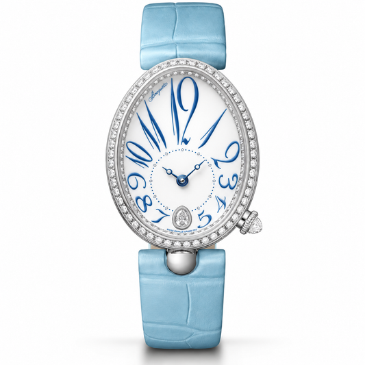 A luxury watch with a light blue alligator leather strap, a white dial featuring blue Arabic numerals, and a bezel set with clear crystals.