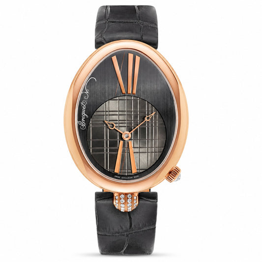 A luxury oval watch with a rose gold case, a black dial featuring a central plaid pattern, and a black leather strap with a crystal-embellished buckle.