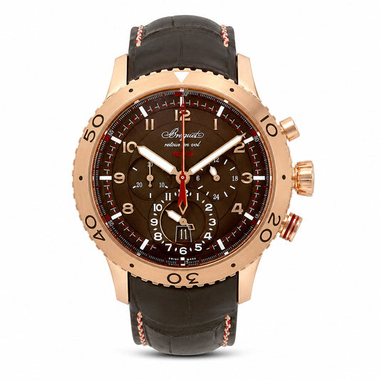 A luxury chronograph watch by Breguet, featuring a rose gold case, a dark brown dial with white Arabic numerals and hands, and a brown leather strap with pink stitching.