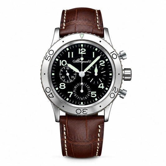 A wristwatch with a silver-toned stainless steel case, a black dial with luminous white numerals and hands, and a brown leather strap with white contrast stitching.