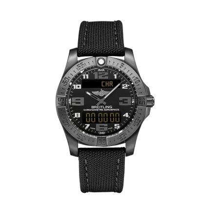 Breitling Aerospace watch with a black dial, silver-tone Arabic numerals, two digital displays, a grey metal case and black fabric strap.

