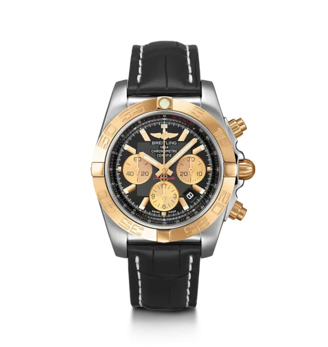 A Breitling chronograph wristwatch with a two-tone stainless steel and gold-tone case, a black dial with gold subdials, and a black leather strap with white stitching.