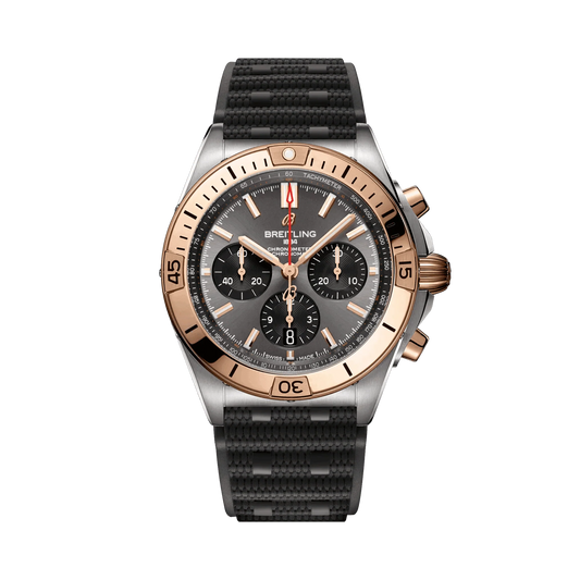 Breitling Chronomat chronograph watch with a grey dial, three black subdials, rose gold tone bezel and accents, date display and textured black strap.