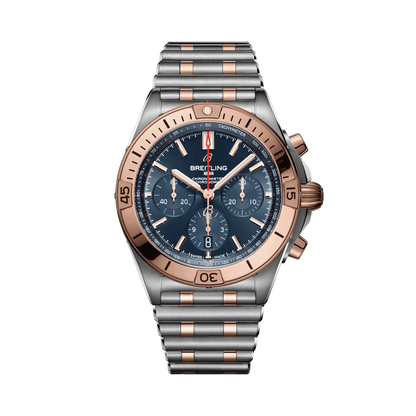 Breitling Chronomat chronograph watch with a blue dial, three subdials, rose gold tone bezel and accents, date display and two-tone metal bracelet.