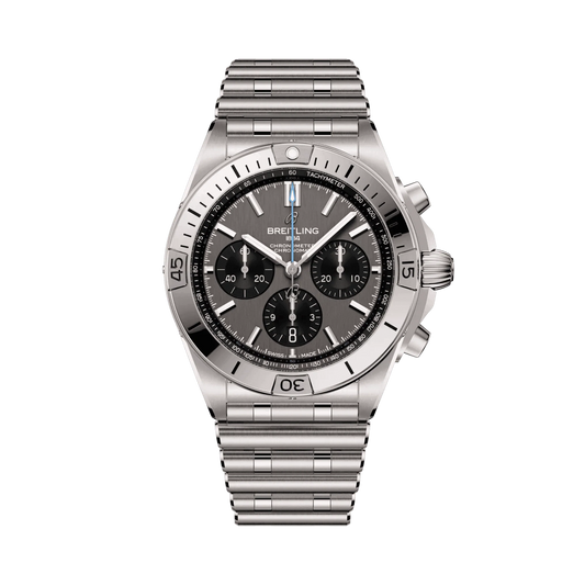 Breitling chronograph watch with a grey dial, three black subdials, silver tone case and numbered bezel, and metal link bracelet.