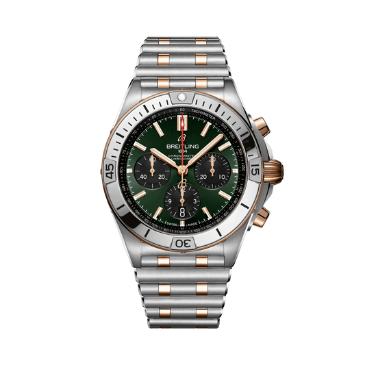 Breitling Chronomat chronograph watch with a green dial, three black subdials, rose gold tone accents, date display and two-tone metal bracelet.