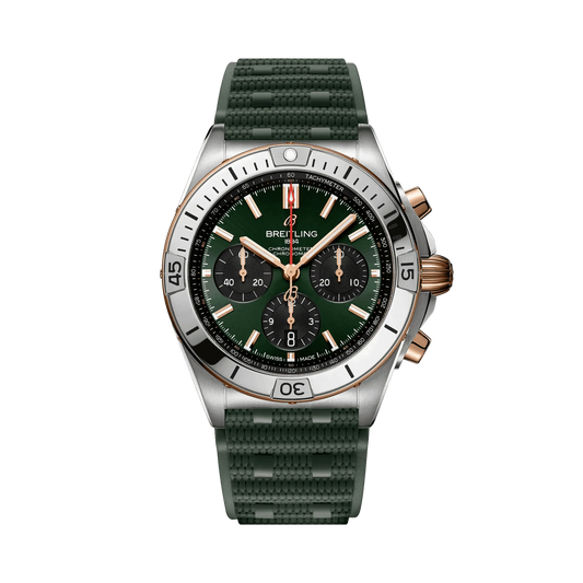 Breitling Chronomat chronograph watch with a green dial, three black subdials, rose gold tone accents, silver tone bezel and textured green strap.