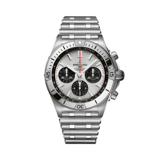 Breitling chronograph watch with a silver dial, three black subdials, red seconds hand, silver tone case and numbered bezel, and metal link bracelet.