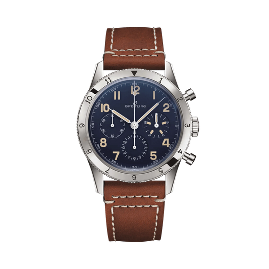 Breitling chronograph watch with a blue dial, three subdials, cream Arabic numerals, numbered silver tone bezel and brown strap with white stitching.