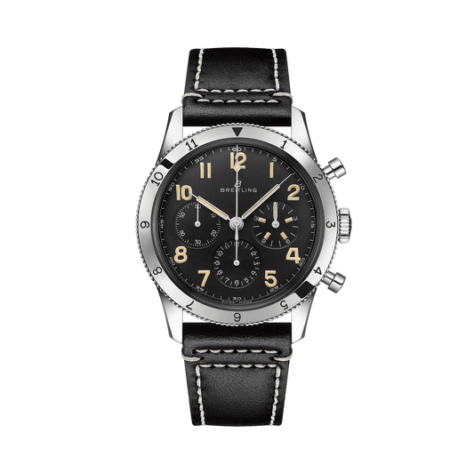 Breitling chronograph watch with a black dial, three subdials, cream Arabic numerals, numbered silver tone bezel and black strap with white stitching.