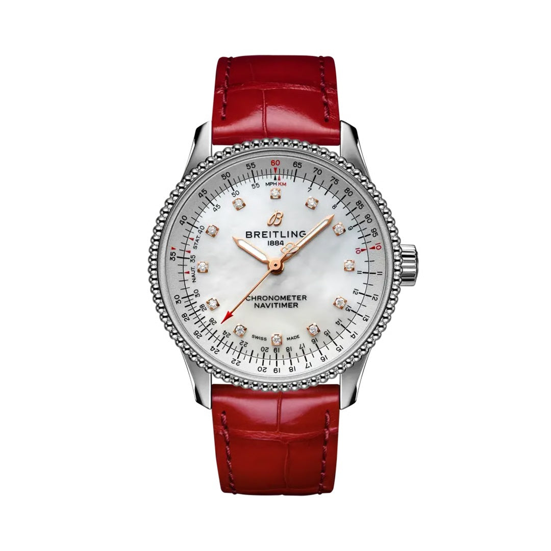 A Breitling chronometer navtimer watch with a silver stainless steel case, a white dial with diamond hour markers, and a vibrant red leather strap.