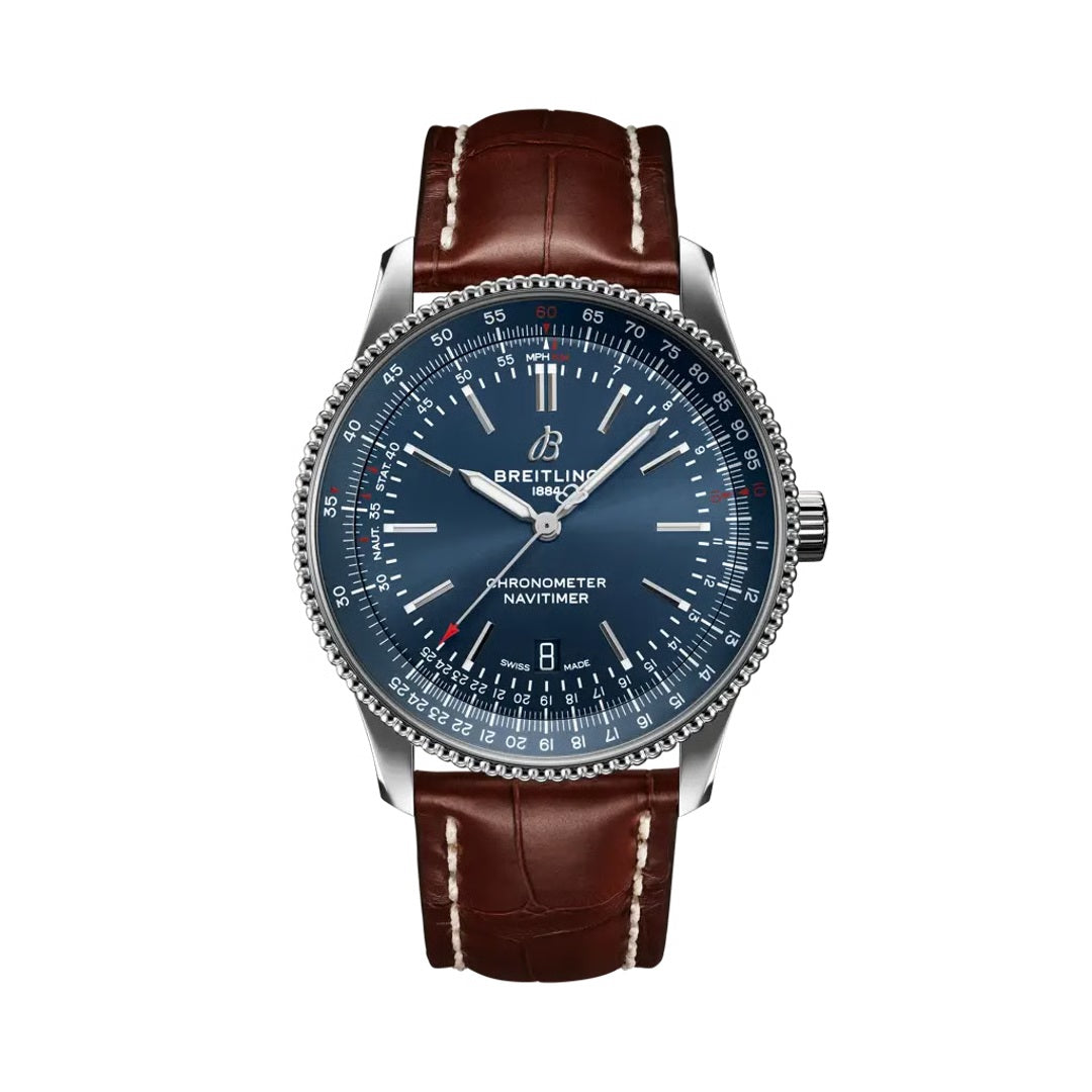  Breitling Navitimer luxury watch featuring a deep blue dial with silver-tone hands and hour markers, stainless steel case, signature slide rule bezel, date display, and brown leather strap with contrast stitching.