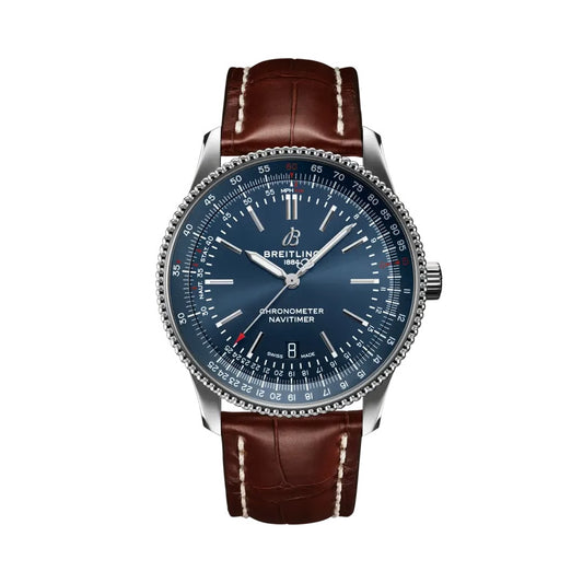  Breitling Navitimer luxury watch featuring a deep blue dial with silver-tone hands and hour markers, stainless steel case, signature slide rule bezel, date display, and brown leather strap with contrast stitching.