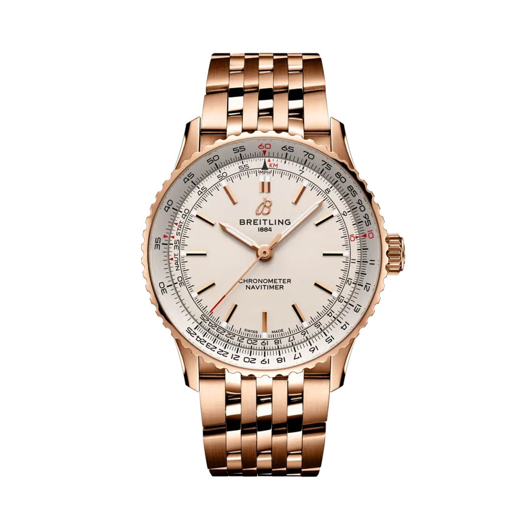 A Breitling Chronometer Navitimer watch with a rose gold metal case and integrated bracelet, featuring a white dial with black and red details.