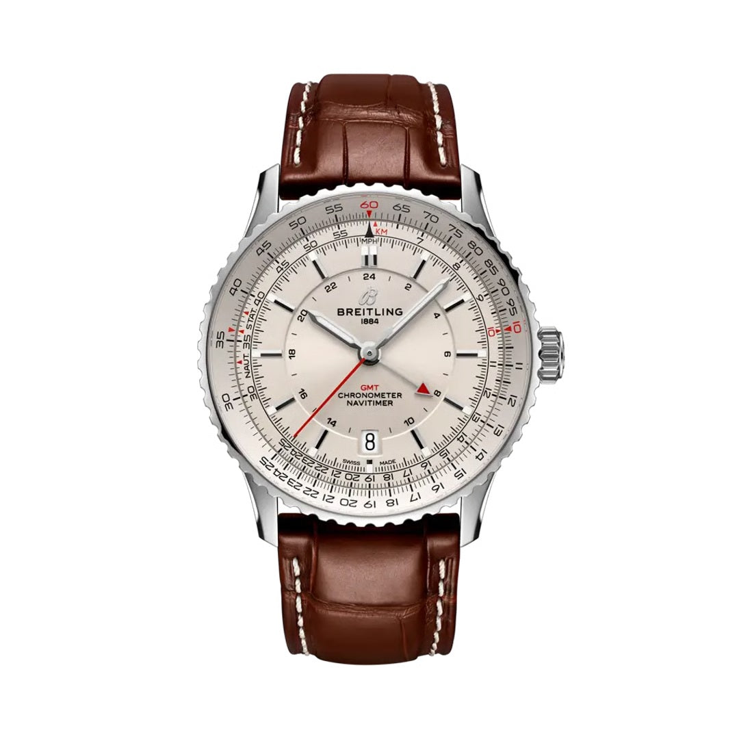 A Breitling Navvimer Off-Sea watch with a silver-tone stainless steel case, a cream-colored dial with black and red markings, and a brown leather strap with white stitching.