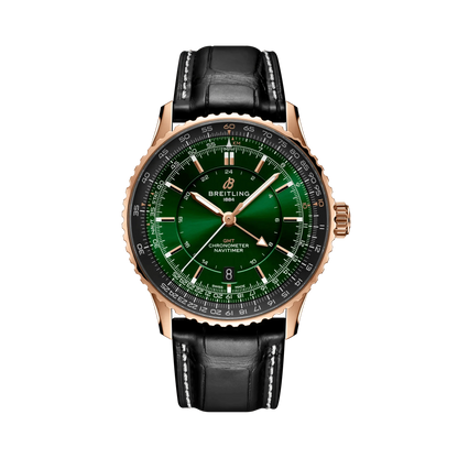 Breitling Navitimer watch with a green dial, rose gold tone case and hands, black numbered bezel and black leather strap with white stitching.