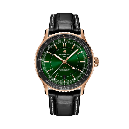 Breitling Navitimer watch with a green dial, rose gold tone case and hands, black numbered bezel and black leather strap with white stitching.