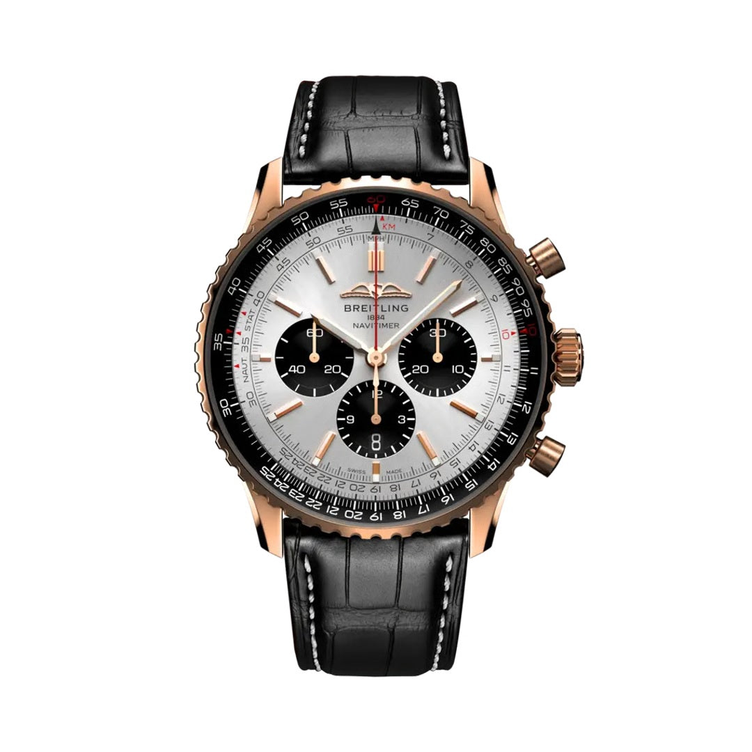 Breitling Navitimer Chronograph watch with a rose gold case, silver dial featuring black sub-dials and rose gold baton markers, black slide rule bezel, and a black leather strap with white stitching.