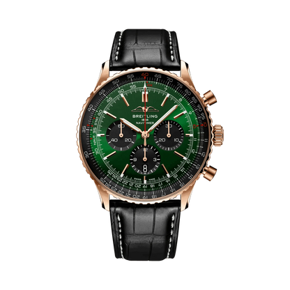 Breitling chronograph watch with a green dial, three black subdials, black numbered bezel, rose gold tone case and black leather strap with white stitching.