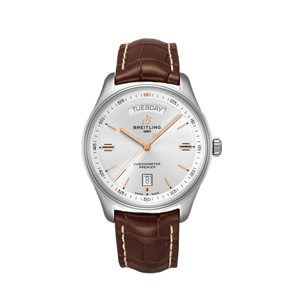 Breitling Premier wristwatch with a silver dial, day and date displays, rose gold tone hands and a brown leather strap.