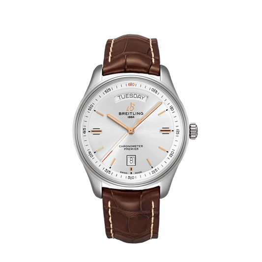 Breitling Premier wristwatch with a silver dial, day and date displays, rose gold tone hands and a brown leather strap.