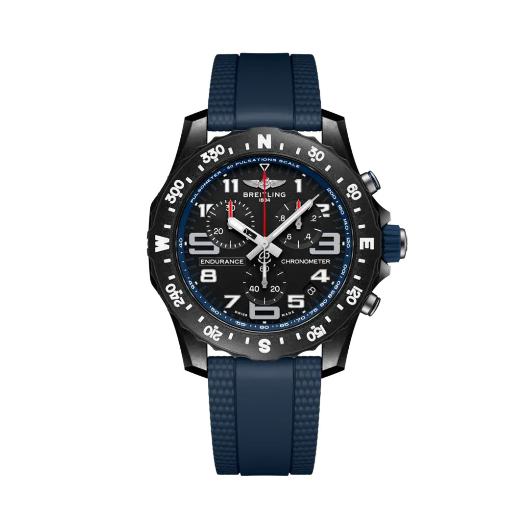 Breitling Endurance Pro chronograph watch featuring a black dial, black compass bezel, three chronograph subdials, luminous  numerals, blue accents, date display, and dark blue rubber strap.