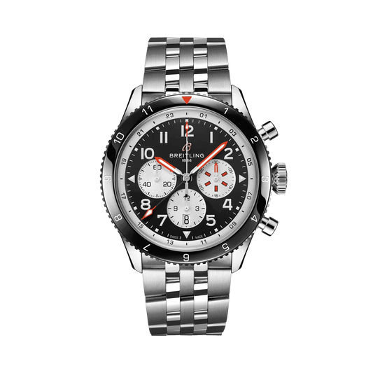 Breitling chronograph watch with a black dial, three silver subdials, red accents, Arabic numerals, black numbered bezel and silver tone metal bracelet.