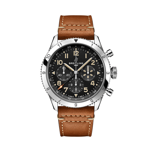 Breitling chronograph watch with a black dial, three subdials, cream Arabic numerals, numbered silver tone bezel and brown strap with white stitching.