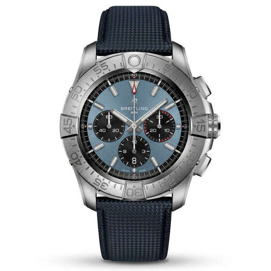 Breitling Super Chronomat B01 44 wristwatch featuring a titanium case, ice blue dial with black chronograph sub-dials, silver baton indices, date window at 6 o'clock, silver bezel with rider tabs, and blue textured rubber strap.