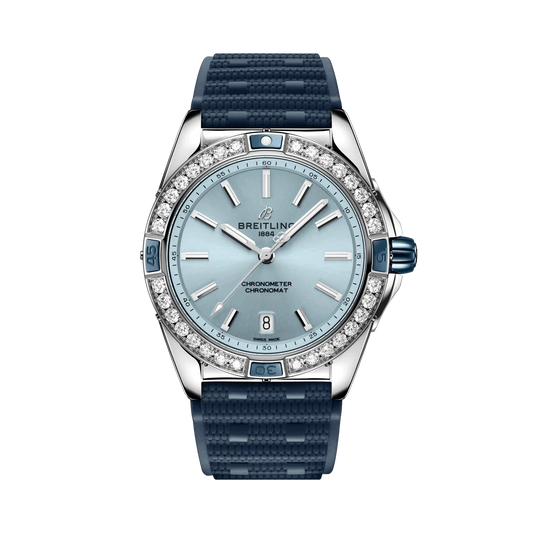 Breitling Chronomat watch with a light blue dial, diamond-set bezel, silver tone case and textured navy blue strap.