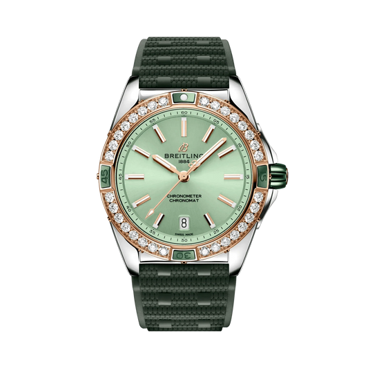 Breitling Chronomat watch with a mint green dial, diamond-set rose gold tone bezel, silver tone case and textured dark green strap.