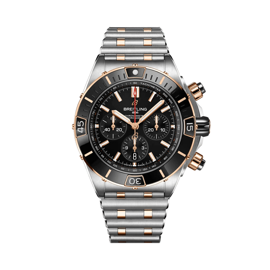 Breitling Chronomat chronograph watch with a black dial, three black subdials, rose gold tone accents, date display and two-tone metal bracelet.