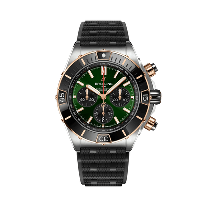 Breitling Chronomat chronograph watch with a green dial, three black subdials, rose gold tone accents, date display and textured black strap.