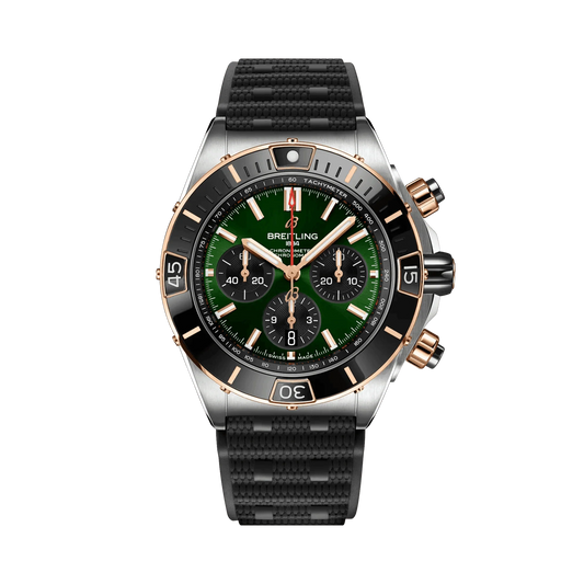 Breitling Chronomat chronograph watch with a green dial, three black subdials, rose gold tone accents, date display and textured black strap.