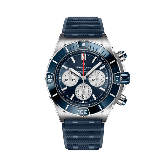 Breitling Chronomat chronograph watch with a blue dial and bezel, three silver subdials, date display and textured blue strap.