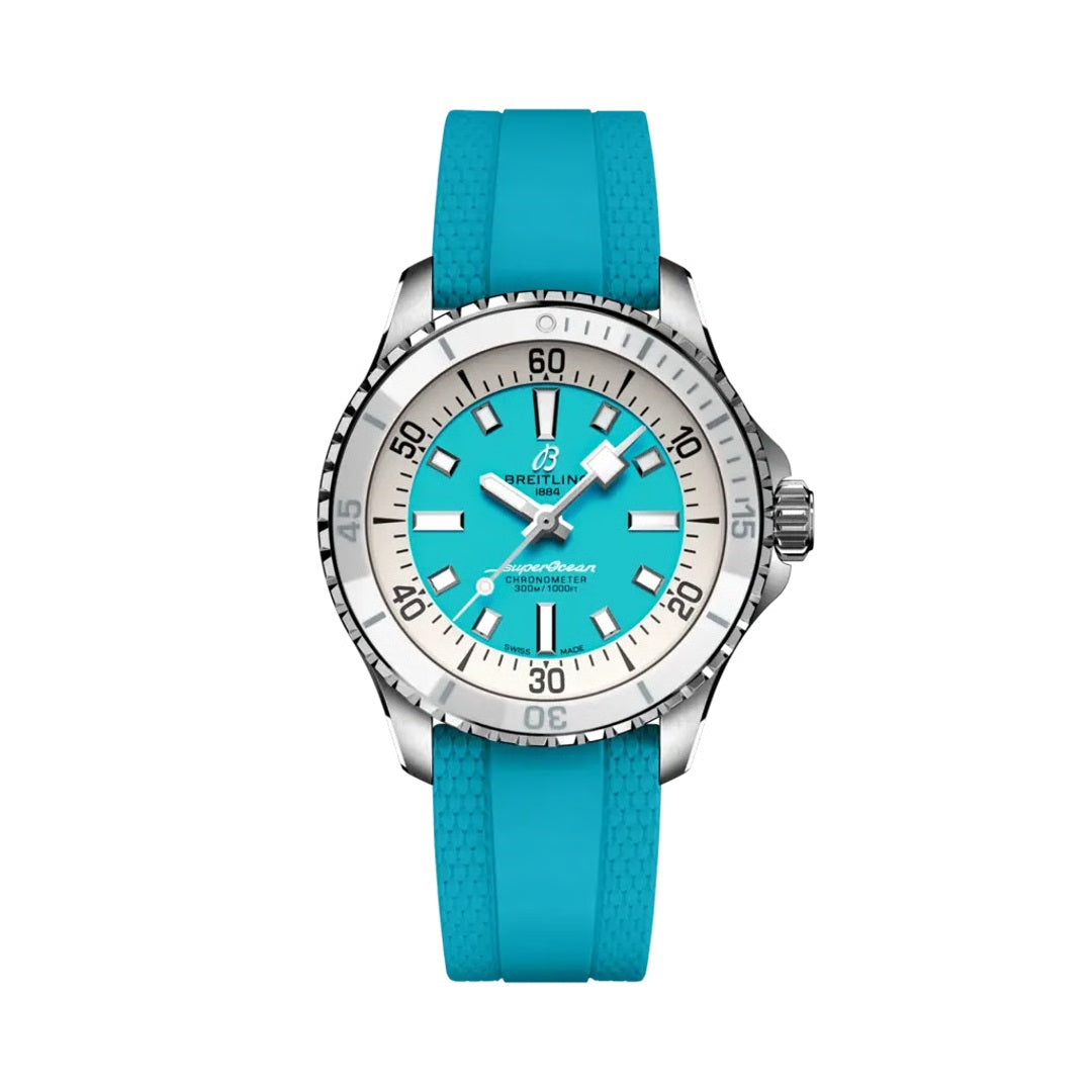 Breitling Superocean Automatic watch with a stainless steel case, turquoise dial featuring white baton markers, silver bezel, and a turquoise rubber strap.