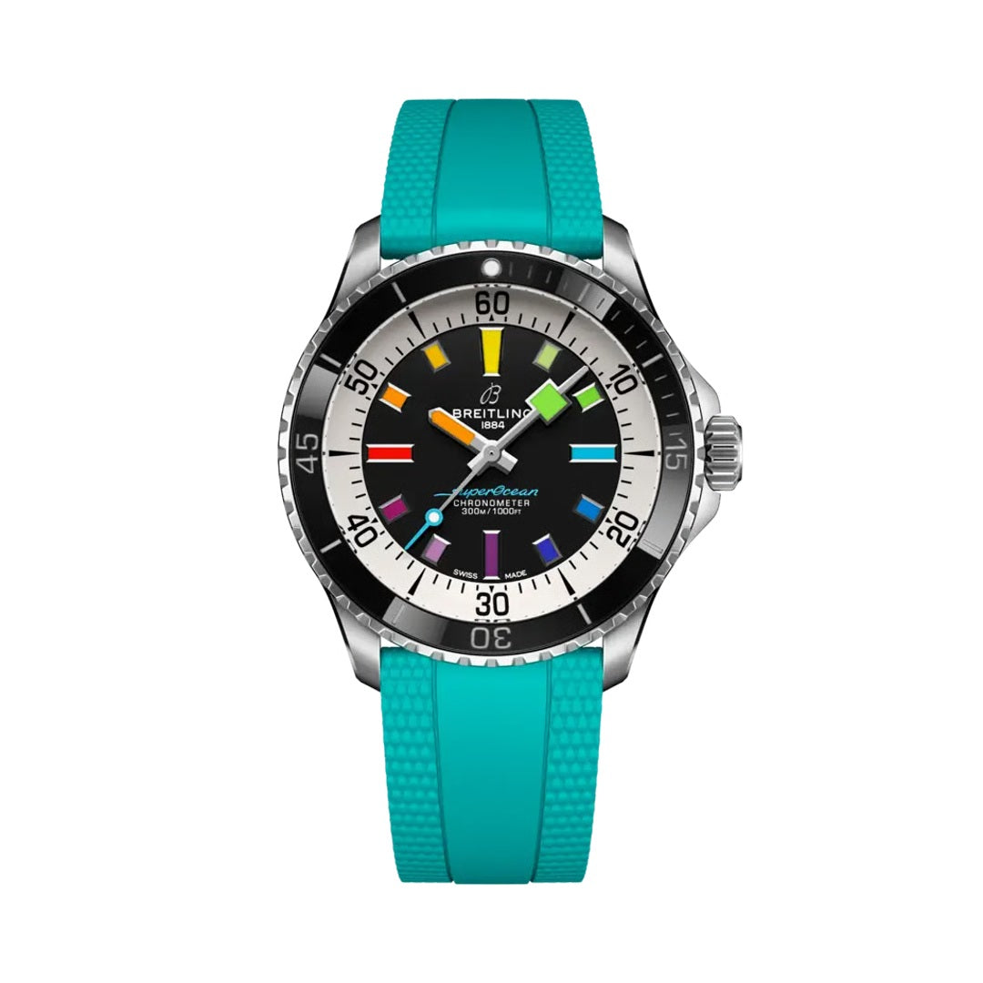 A Breitling watch with a bright turquoise rubber strap, a silver stainless steel case, and a black dial featuring colorful, multi-colored hour markers.