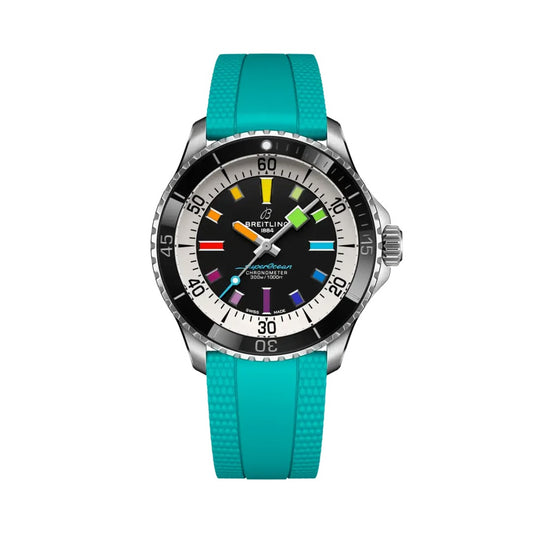 A Breitling watch with a bright turquoise rubber strap, a silver stainless steel case, and a black dial featuring colorful, multi-colored hour markers.