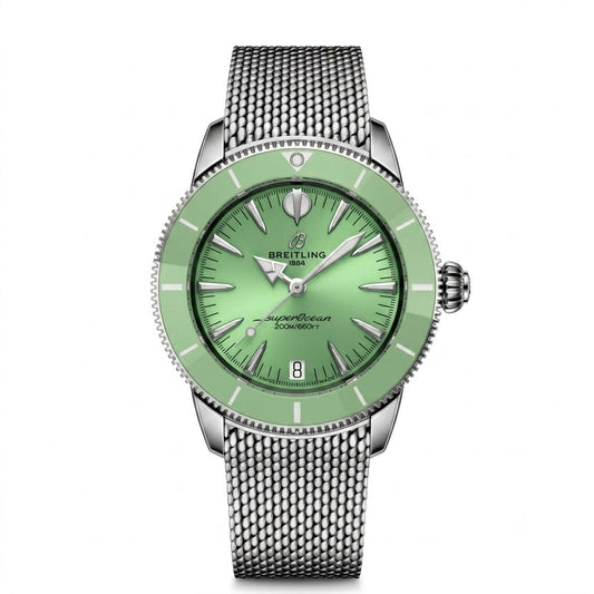 A Breitling watch with a light green dial and bezel, a silver-tone stainless steel mesh bracelet, and silver-tone hands and indices.