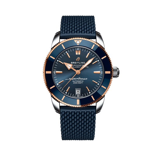 Breitling Superocean Heritage watch with a blue dial and bezel, rose gold-tone details, date display and textured blue strap.