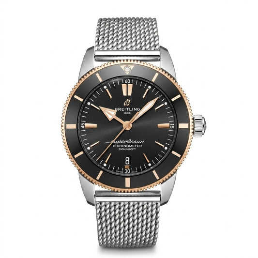 Breitling Superocean Heritage B20 Automatic wristwatch featuring a stainless steel case, black dial with rose gold baton indices and hands, black and rose gold unidirectional bezel, date window at 6 o'clock, and stainless steel mesh bracelet.