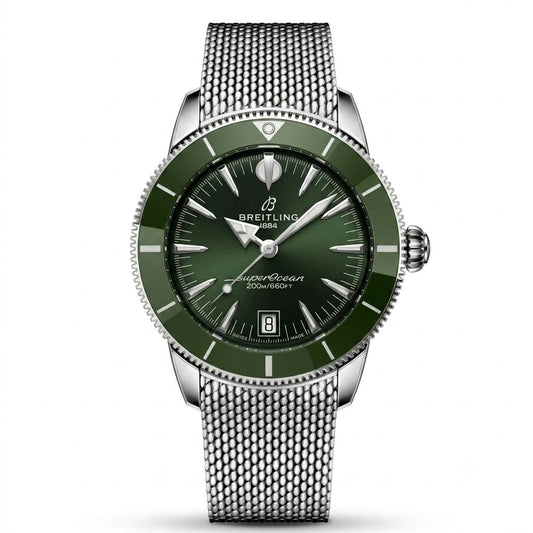 Breitling Superocean Heritage luxury automatic watch featuring a deep green sunburst dial with silver-tone hands and hour markers, matching green rotating bezel, stainless steel case, date display, and stainless steel mesh bracelet.