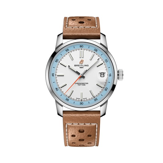Breitling watch with a white dial, light blue numbered bezel, silver tone case, date display and perforated tan leather strap with white stitching.