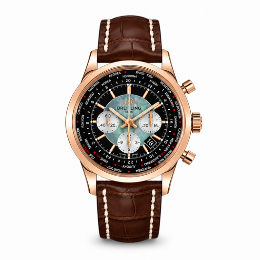 Breitling Transocean Chronograph Unitime watch featuring a polished rose gold case, black and silver dial with world time city ring, three white sub-dials, date window, and a brown leather strap with white stitching."