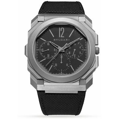 Bvlgari chronograph watch with a silver-tone case, dark grey dial with three subdials, and a black fabric strap.