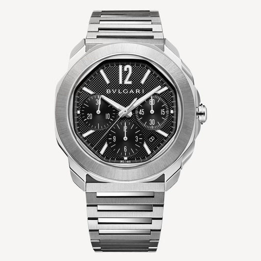 Bvlgari chronograph watch with a silver-tone case and bracelet, black dial, three subdials, and a prominent 12 o’clock numeral.